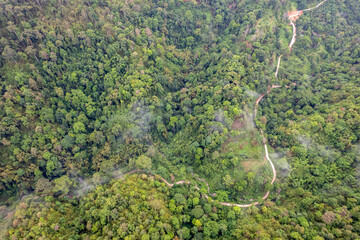 Landscape of Morning Mist with Mountain Layer. mountain ridge and clouds in rural jungle bush forest