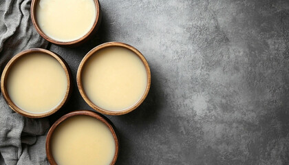 Tasty broth and different cream soups in bowls