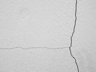 Obraz premium Crack wall texture background broken earthquake effect, whtie grey building cement damage pattern plaster grunge black line paint surface abstract, construction rough street concrete backdrop.