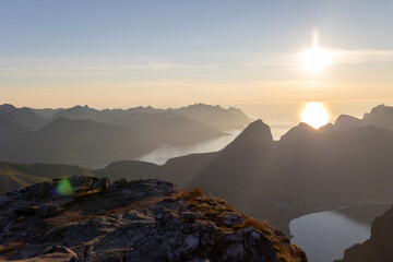 Children and adults, family with dog, hiking Grytetippen trail in Senja, Lofoten on a sunny hot summer day