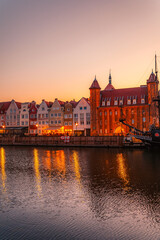 Fototapeta premium Gdansk with Motlawa river in Poland. Old town colourful house with Stragania Gate