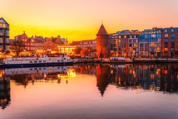 Gdansk with Motlawa river in Poland. Old town colourful house with Stragania Gate