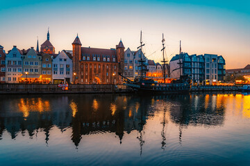 Obraz premium Gdansk with Motlawa river in Poland. Old town colourful house with Stragania Gate