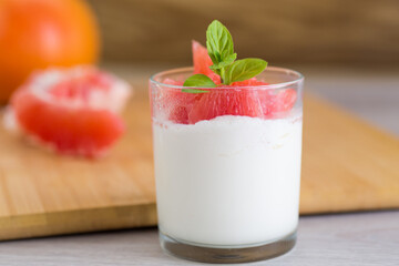 Healthy dessert made from yogurt and fresh grapefruit pieces