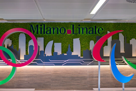 Olympic five rings Milano Linate, symbol global sport, for Milan Winter Games 2026, Italy awaits, vibrant welcome, travel hub, global unity through sport, Milan, Italy