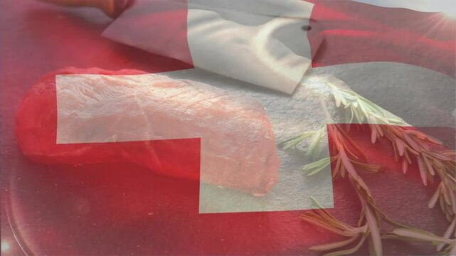 Swiss flag overlay appearing over raw meat and fluctuating then fading to reveal cleaver, rosemary