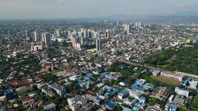 Panoramic aerial overview of bustling cityscape and buildings at Cubao, Quezon City, Philippines