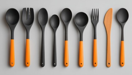 Stylish Black and Orange Kitchen Utensils Set Spoons Spatula Fork Knife Cooking Tools Flat Lay