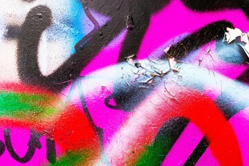 Dynamic graffiti art with neon pink, red, blue accents on textured wall. 90s urban, street, vibrant...
