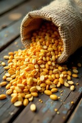 Golden Grains Overflowing from a Rustic Burlap Sack onto Weathered Wooden Planks