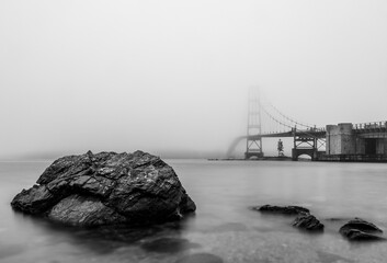 Foggy view of Deer Isle suspension bridge disappearing into the mist