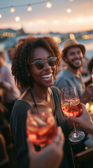 Friends toasting with cocktails on a rooftop bar during golden hour