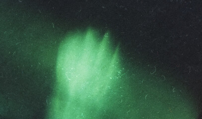 Vintage green abstract light leak overlay noise background with a dust and Scratches texture....