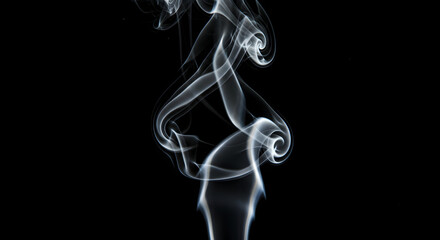 Elegant Smoke Trails Against Dark Backdrop Emitting Graceful Dance