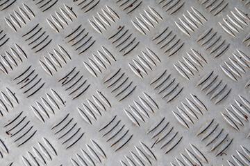Textured Steel Tread Plate Surface with Diagonal Anti-Slip Pattern for Industrial Use