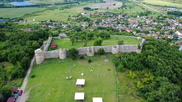 Panoramic drone view of the medieval Neoutzikon Fortress near Mezek village, Bulgaria. Built in the 11th century, it served as a key border defense in the Eastern Rhodope Mountains.