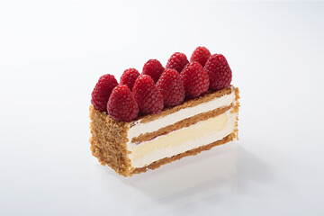 Gourmet Layered Cake Slice Topped with Fresh Raspberries