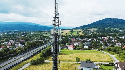 Telecommunications tower and town landscape in mountains
