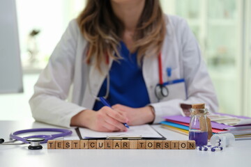 A healthcare professional in a clinical setting discusses and writes about the important topic of...