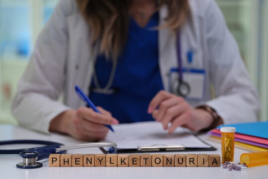 A healthcare provider documenting essential information about phenylketonuria in a clinical setting