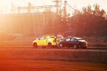 Yellow tow truck on roadside job