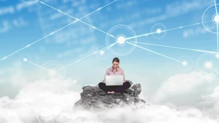 Woman typing on silver laptop atop rocky outcrop generating expanding tech network across clouds - Powered by Adobe