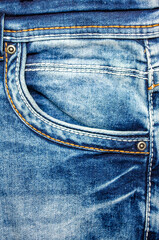 Close-up of trendy denim jeans pocket with stitching