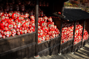 Osaka, Japan - December 2024: Scenic view of Katsuoji Temple in Minoh during peak autumn season. Beautifully framed by vibrant red and orange maple leaves, reflecting the serene atmosphere of autumn.