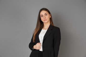 young businesswoman posing in studio background