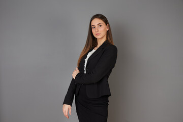 young businesswoman posing in studio background