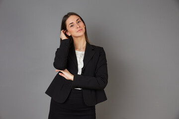 young businesswoman posing in studio background