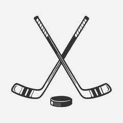 Crossed Hockey Sticks and Puck Icon Set – Black and Colorful Flat Design Illustrations for Ice Hockey, Winter Sports, and Team Logos. Hockey Stick Logo Vector Template Design. 