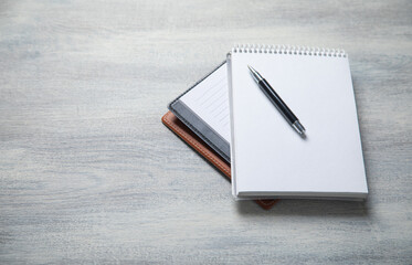 Notepad and pen on the table. Business
