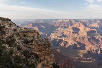 A view of the Grand Canyon is a breathtaking panorama of immense, colorful rock formations, steep cliffs