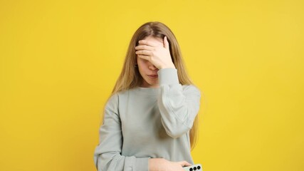Young woman expressing various negative emotions on yellow background - Powered by Adobe