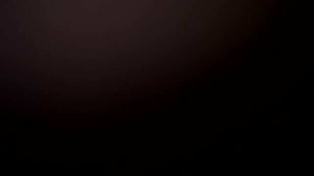 Cinematic light leak overlay with glowing textures and faded flares designed for vintage film transitions