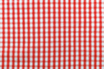 Checkered red fabric. Textile. Checkered fabric background with blue and white cells