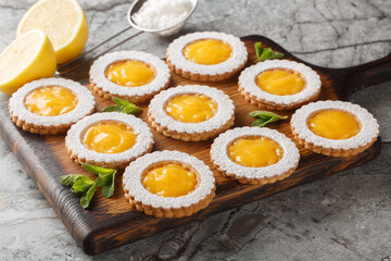 Amazing Lemon Curd Cookies soft bright, and refreshing closeup on wooden board on the table....