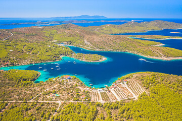 Aerial view of beautiful beaches near the town of Hvar, Croatia, showing turquoise waters, rocky coastline, and lush greenery, ideal for swimming, sunbathing, and enjoying the Adriatic summer