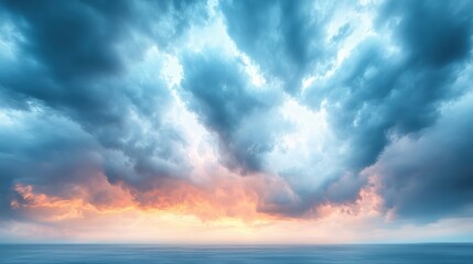 Fototapeta premium Dramatic Cloudscape Over the Ocean During Sunset Showcasing Majestic Blue Orange Hues for Serene Escape