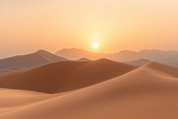 Sunrise over golden sand dunes in the desert creates a breathtaking view of nature's beauty at dawn