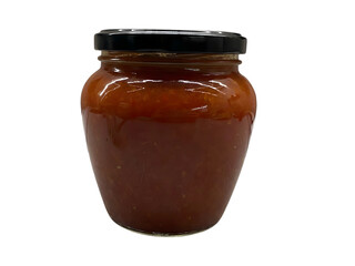Jar of homemade relish with black metal lid isolated against black background