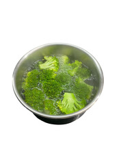 Fresh Broccoli Florets Steaming in a Stainless Steel Pot on a Black Surface