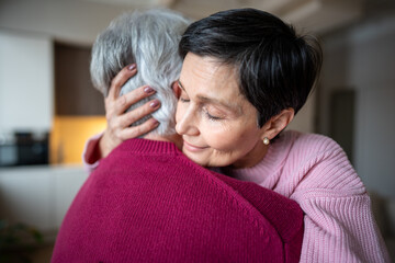 Trust and support in retired couple. Calm happy mature wife hugs husband with love, woman gives emotional support, family care, affection and understanding, caring in difficult times, emotional bond