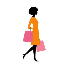 A woman in an orange dress is carrying two pink shopping bags.