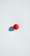 AI-Generated of Negative Space Concept with Minimalist Red Umbrella on White Background