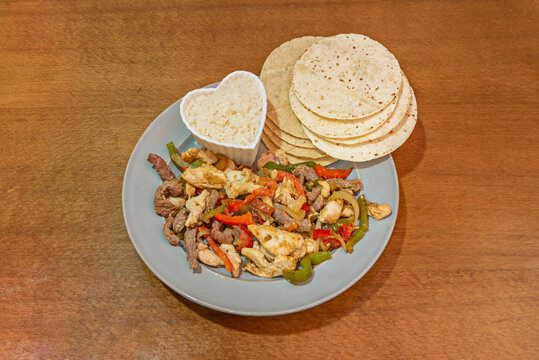 Barbacoa Tacos: Meat (often lamb) slowly cooked in a pit underground until tender, accompanied by broth.
