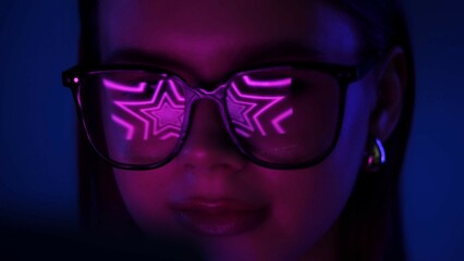 Woman Wearing Glasses Reflecting Neon Pink Star Lights
