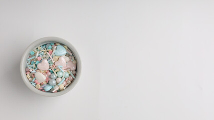 Colorful sprinkles with various shape on white background