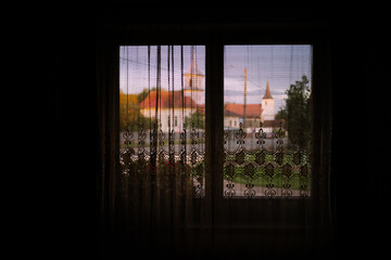 Fototapeta premium summer sunset through a window from inside
